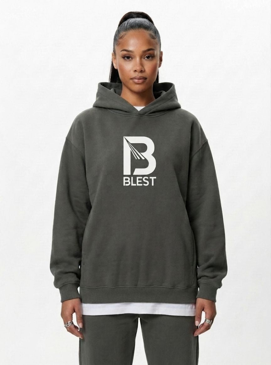 woman wearing the Blest grey pullover hoodie with white B Blest logo