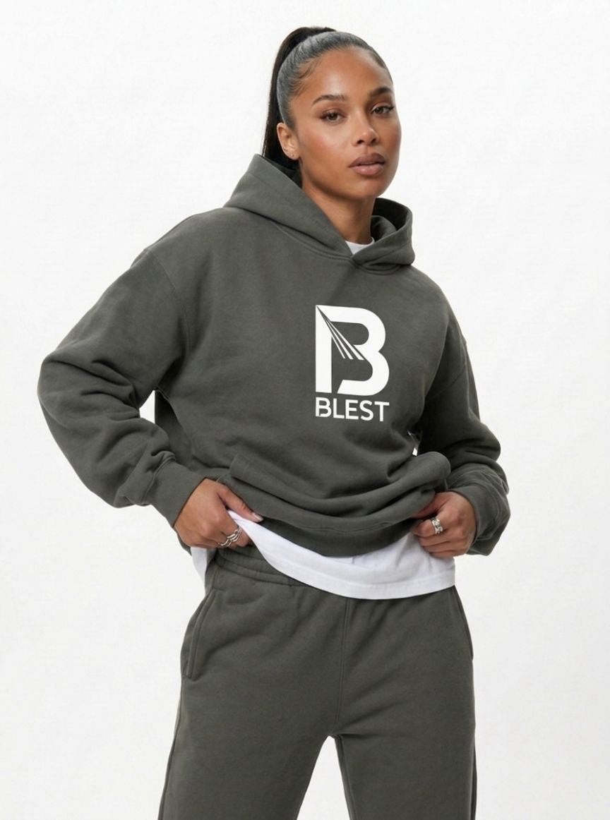 female model posing with the Blest grey  hoodie 